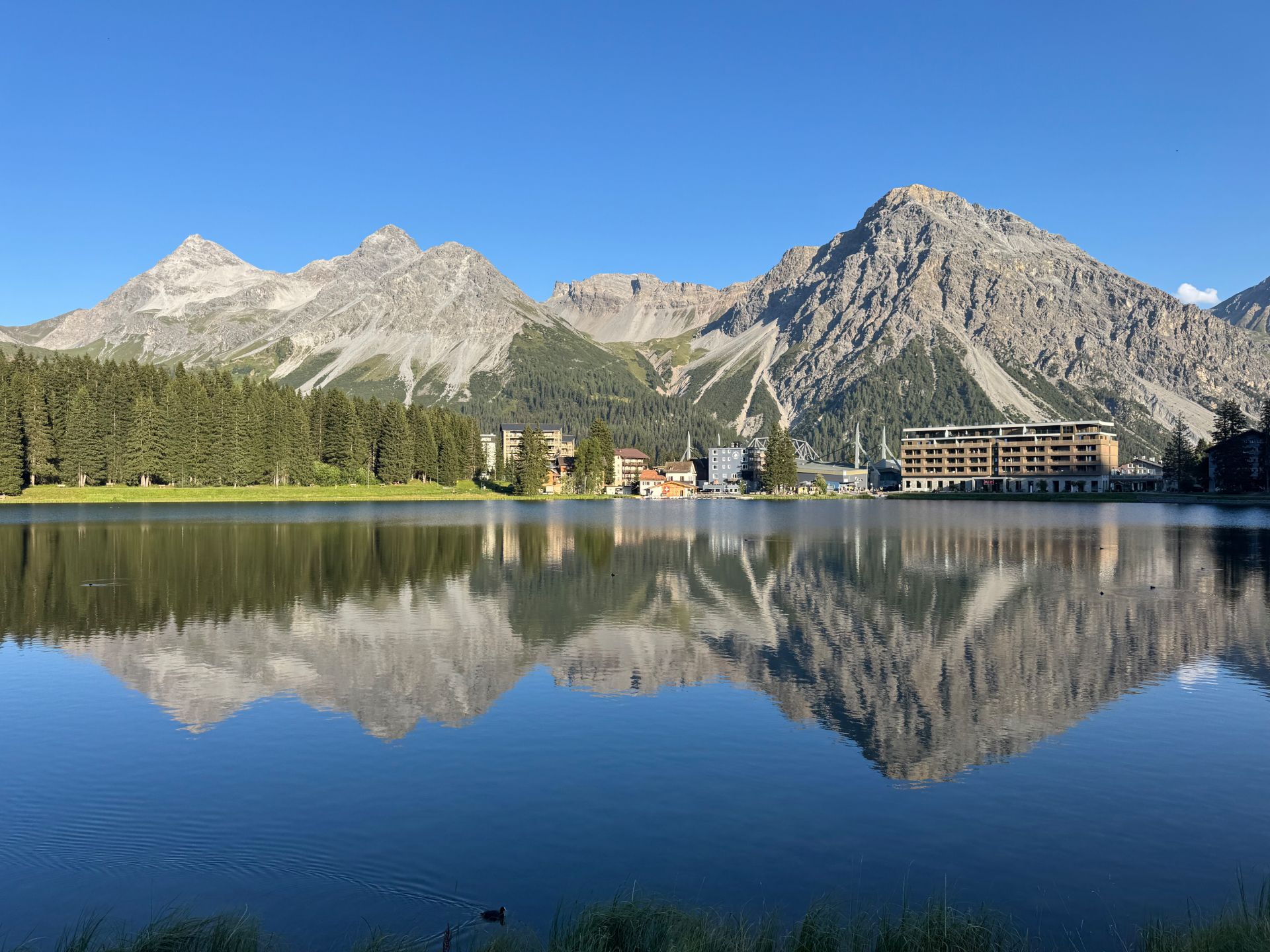 The Obersee in Arosa, its surface a perfect mirror for the surrounding peaks