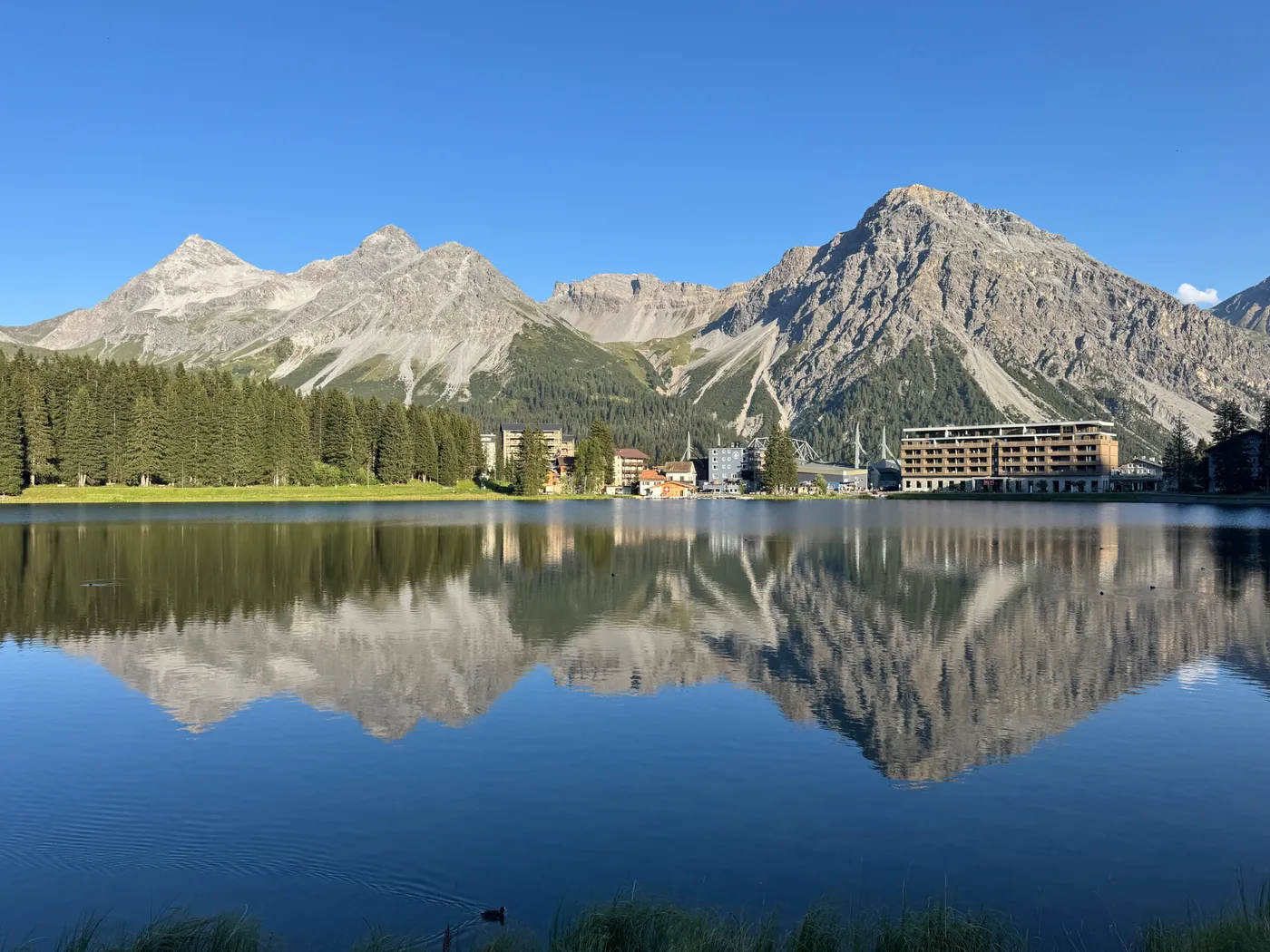 The Obersee in Arosa, its surface a perfect mirror for the surrounding peaks